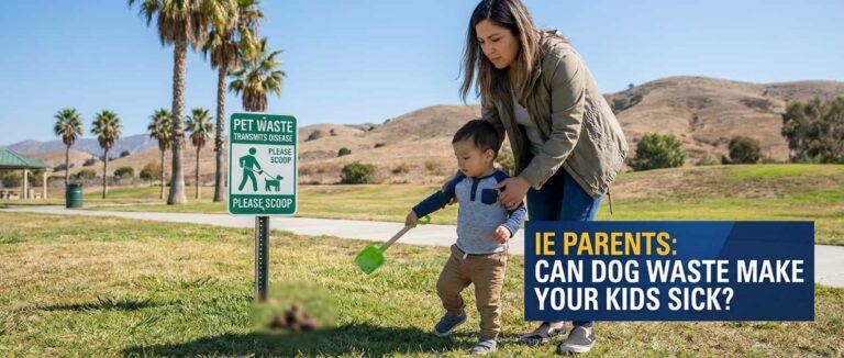 Mother and toddler beside a 'Pet Waste Transmits Disease - Please Scoop' sign in an Inland Empire park, with dog waste on the grass nearby.